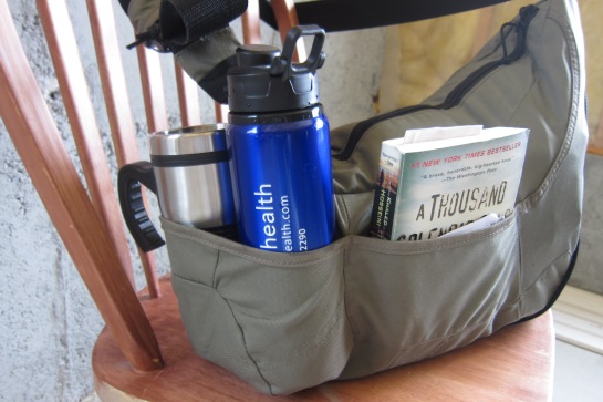 The bag has external pockets which are great for water bottles, & books. 